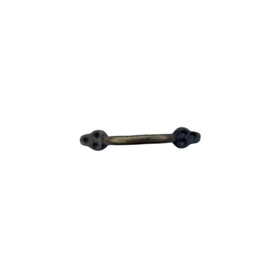 Cast iron handle in brass finish with 6 holes showing the top.