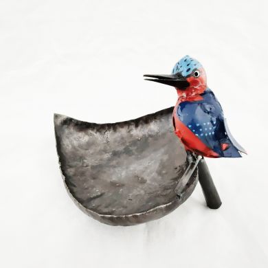 Handpainted metal king fisher bird bath sitting on a leaf