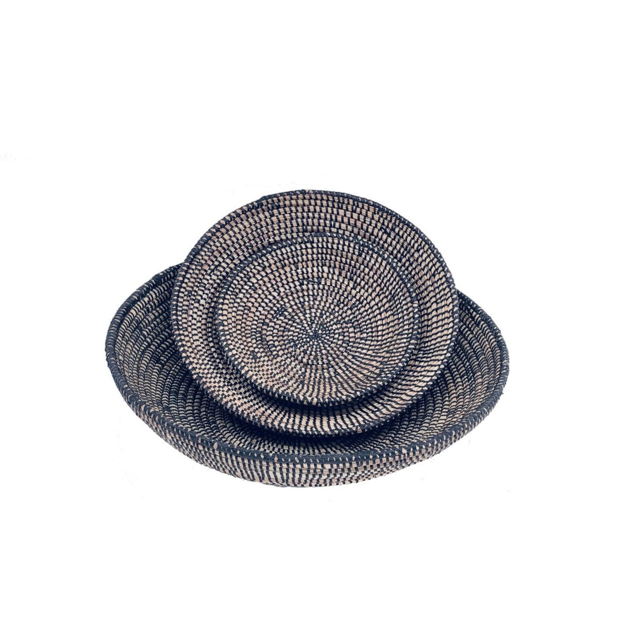 handcrafted round baskets. Three sizes made with recycled plastic and straw. Stacked set of three. Black
