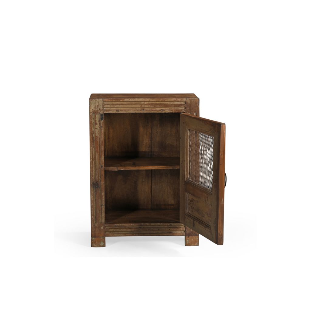 Vintage teak locker with single door. There's an open panel covered with metal mesh. It has one inner shelf and a brass handle. The front frame has carved lines. Showing the door open.