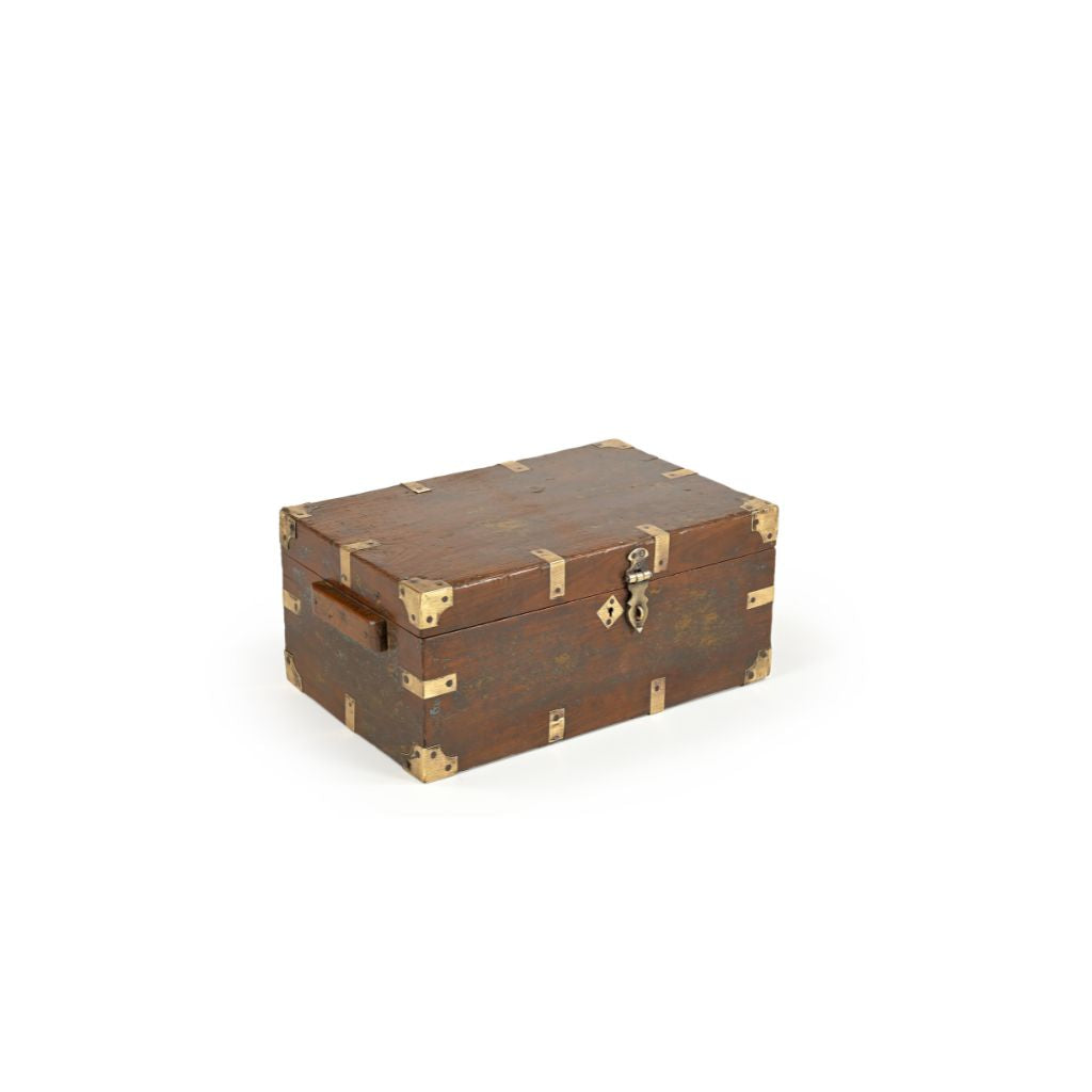 Vintage dark wood box with brass casings and latch showing wood side handle