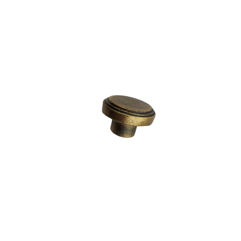 Round Disk with a rim in antique brass finish cast iron knob showing the side.