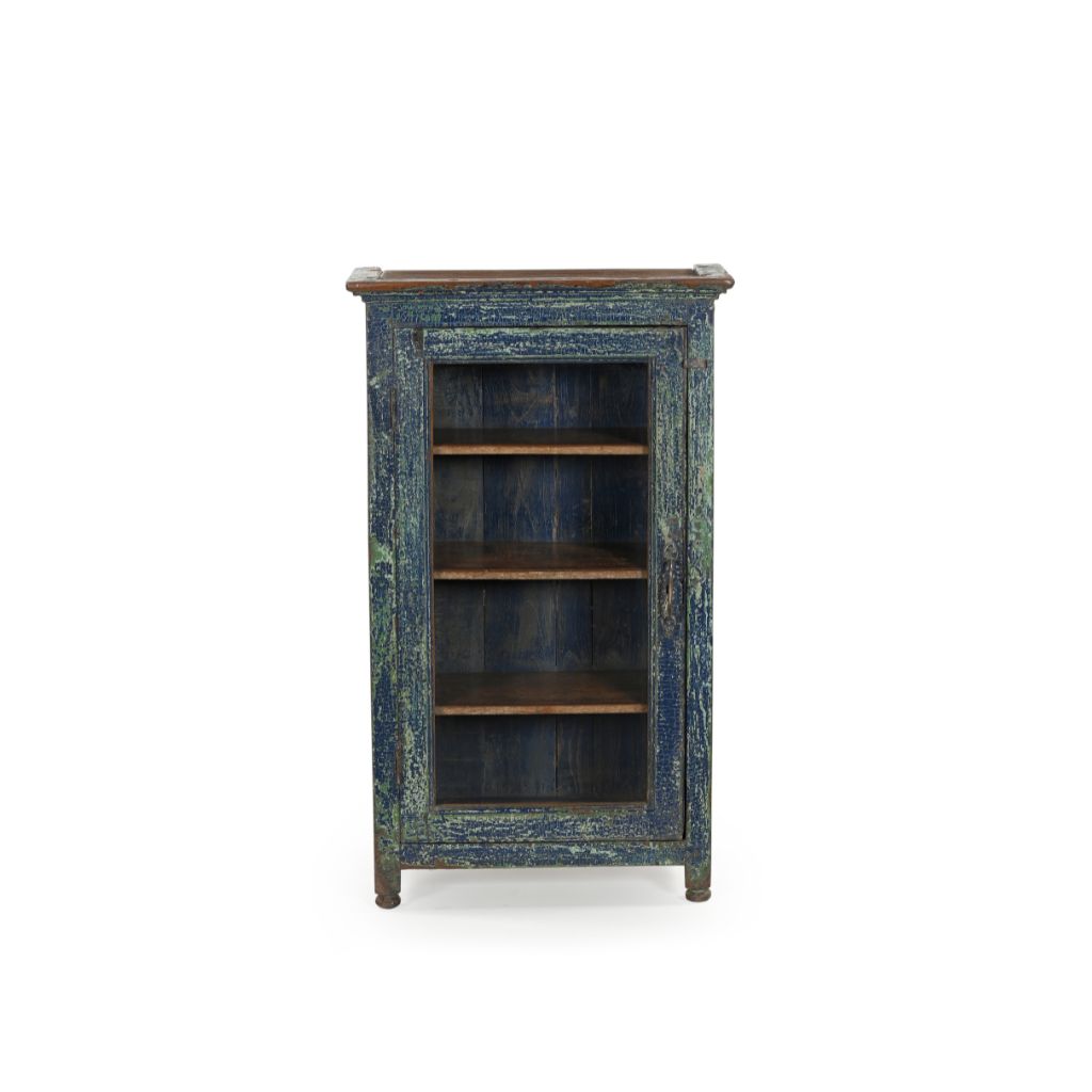 Small vintage wood cabinet with a glass door. It has 3 inner shelves and has a distressed blue patina. Front view.