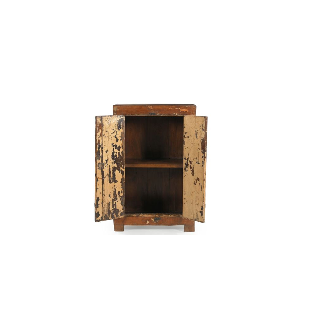 Vintage natural wood cabinet with a reminiscence of cream paint on the two front doors. There's metal casings & hinges with a lockable latch. Showing doors open revealing one inner shelf.