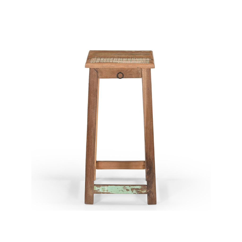 Counter wood stool made of reclaimed wood with original distressed paint. It has one tiny drawer under the square seat. Showing the front view.