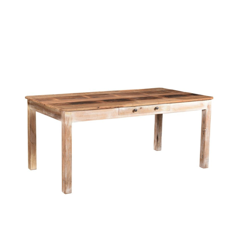 Reclaimed wood dining table with one central drawer under the natural wood top. The legs are painted whitewash. Showing the sideview.