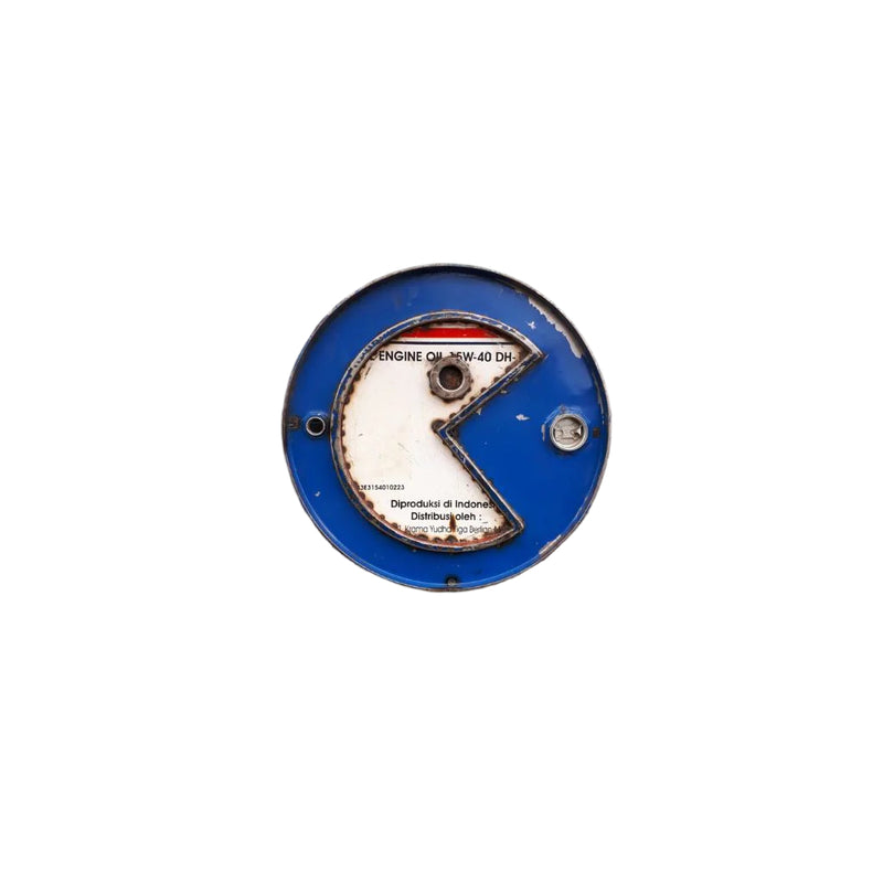 Recycled metal art work made from the top of an oil barrel representing Pacman in blue & white.
