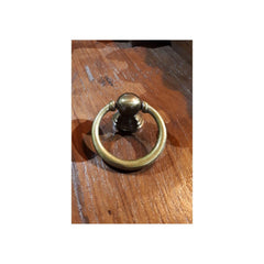 metal ring for drawer in brass finish.