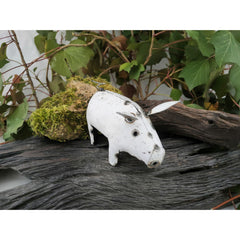 White Recycled Metal Pig front view on log