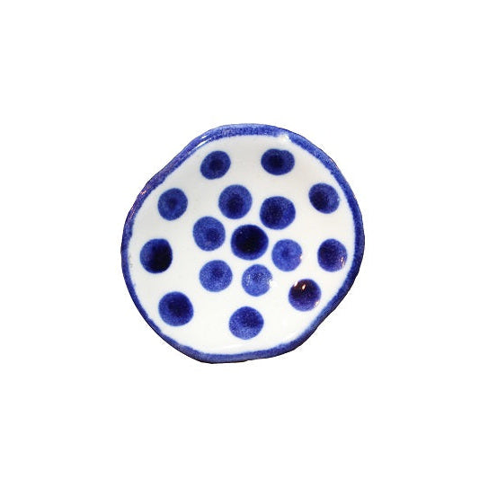 Large ceramic white knob with blue polka dots uneven & blue trim.