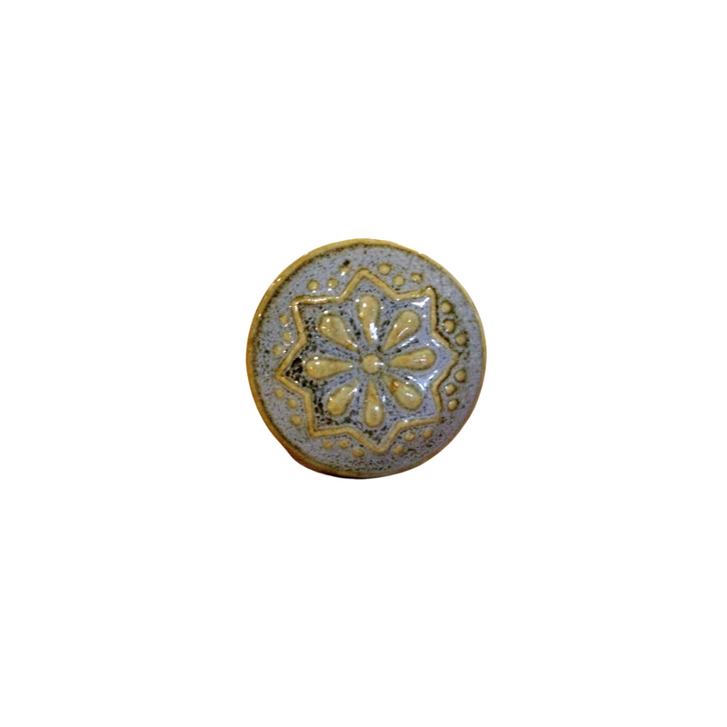Royal ceramic knob handmade and painted with a blue/grey base and raised yellow pattern
