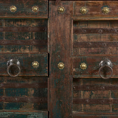 This is a 4 doors cabinet handcrafted in dark wood & original Shekawati antique doors with a dark green patina & copper embellishment  with close up view of brass and iron cast handles