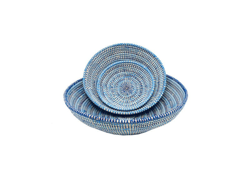 handcrafted round baskets. Three sizes made with recycled plastic and straw. Stacked set of three. Vibrant blue