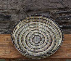 handcrafted tray basket made of recycled plastic and straw. black and grey