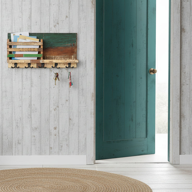 Wooden wall-mounted shelf with hooks in a coastal style entrance
