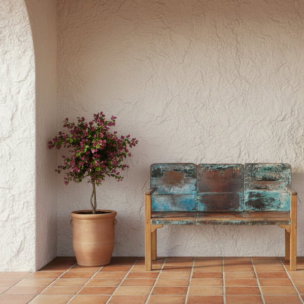 3 seaters Wooden bench with a distressed finish in a white entrance with a flower pot 