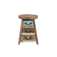 Wooden stool with three drawers on a white background