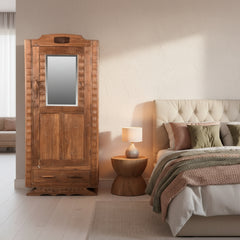 Wooden wardrobe with a mirror in a bedroom