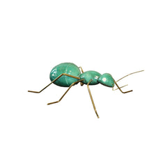 Gren ant with body made of ceramic with legs made of copper. Can be sitting on a table or hanging on a wall.