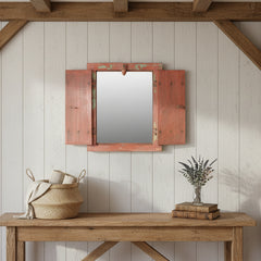 Wooden-framed mirror with rustic design on a white wall with a console under