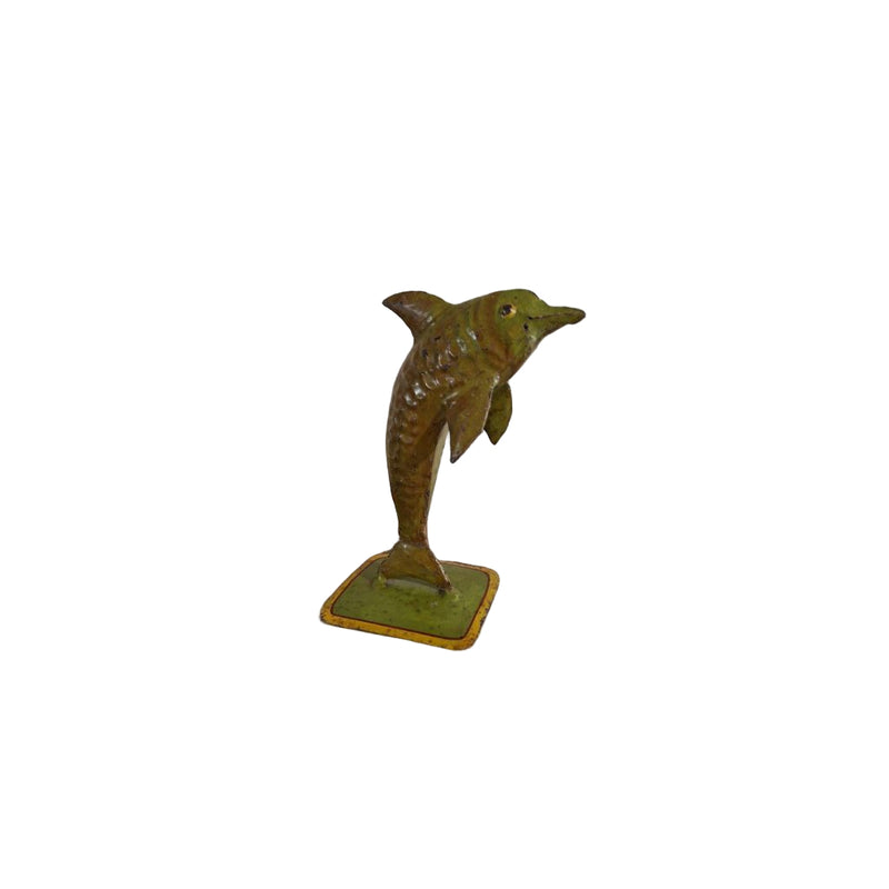 Green dolphin figurine on a white background