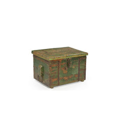 Vintage wood trunk painted in green distressed with metal casings & and a lockable latch, showing the side which have a metal ring handle.