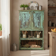 Blue green wood cabinet with 2 doors & 2 open shelves at the bottom in a kitchen setting.