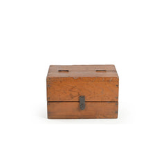 Vintage teak wood box with a lockable latch showing the front.