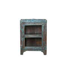 Vintage wooden & glass door cabinet with blue and brown patina on a white background