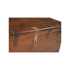 Vintage Teak wood trunk with metal casing around the hedges and a brass lokable latch, showing the closeup of the latch..