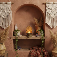 brass candle holder in an alcove 