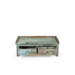 Vintage-style wooden coffee table with a distressed finish on a white background showing the drawers open