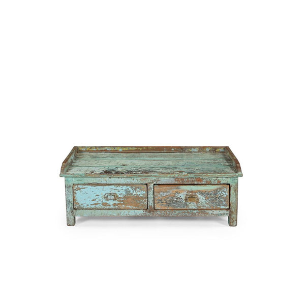 Vintage-style wooden coffee table with peeling paint finish on a white background