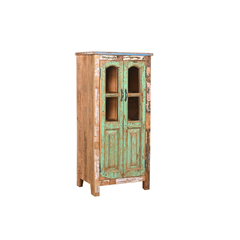 A rustic, distressed wooden cabinet with a weathered green and brown paint finish, featuring two glass-paneled doors and dark metal handles, on a white background