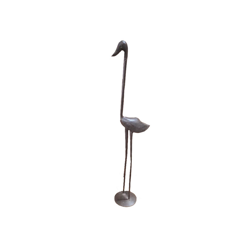 A metal sculpture of a brown bird with a long neck, standing on a circular base.