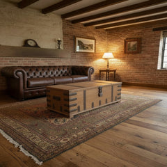 Vintage teak trunk in a rustic living room