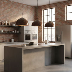 metal lamp shade hanging over a modern kitchen island