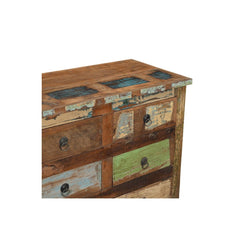 detail of 16 drawers sideboard coloured wood in a white background