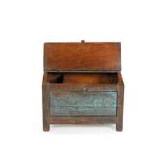 Vintage writer desk in wood with blue disstressed patina with brass latch showing the top open where there's a separate compartment inside