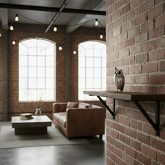 small silver owl in an industrial living room on  shelf