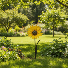 Recycled metal sunflower in a seeting of a garden