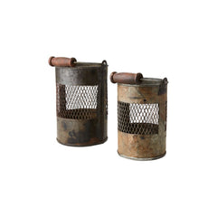 vintage metal lantern with a wood handle & a metal mesh on each side on a white background