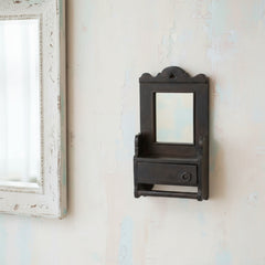 Small dark wooden shelf with a mirror on a white background
