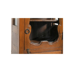 Light teak wood wall glass cabinet with an ornate glass door and a drawer at the bottom showing the detail of the ornate door.