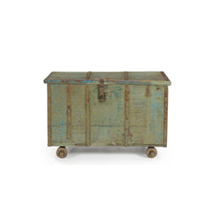 Vintage light blue wood trunk on 4 wheels with a metal latch & metal casing front view