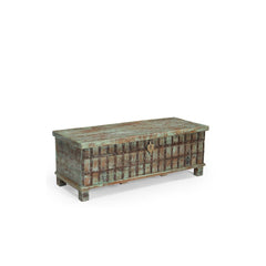 Vintage wooden trunk with a weathered blue finish on a white background, showing the side.