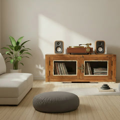 vintage teak wood low cabinet with 2 glass doors in a living room with a record player on it and 2 speakers
