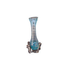 Decorative vase with a blue glass body and wooden base on a white background