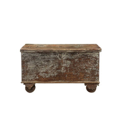 Vintage wooden trunk on wheels on a white background