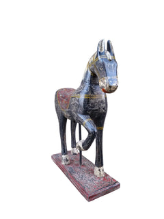 handpainted vintage wood horse on a wooden stand in a white background